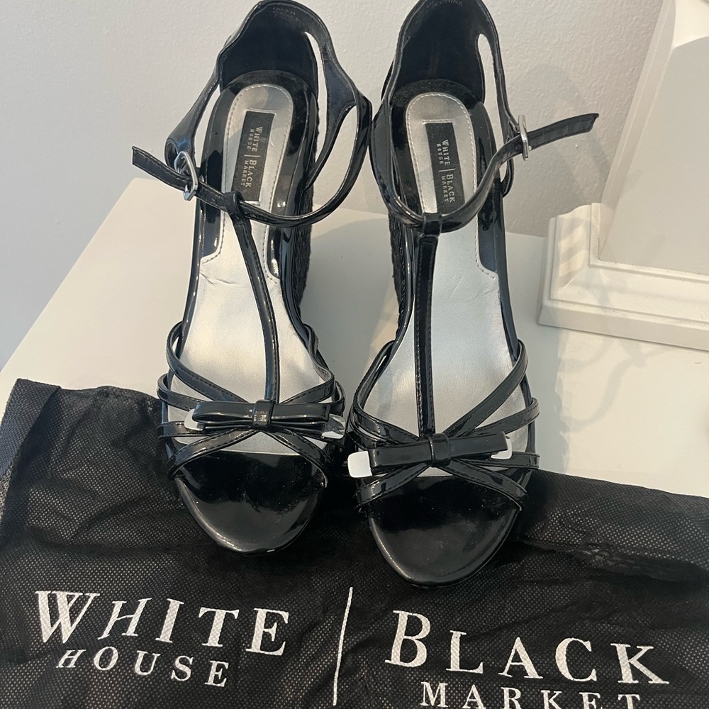White House Black Market black patent leather wedge sandals.